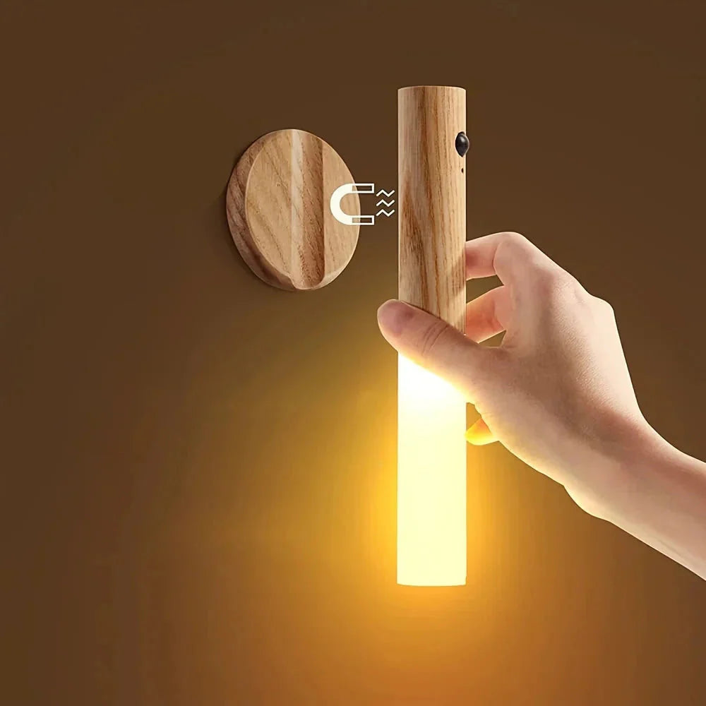 Wooden motion sensor night light lifted from its magnetic wall mount