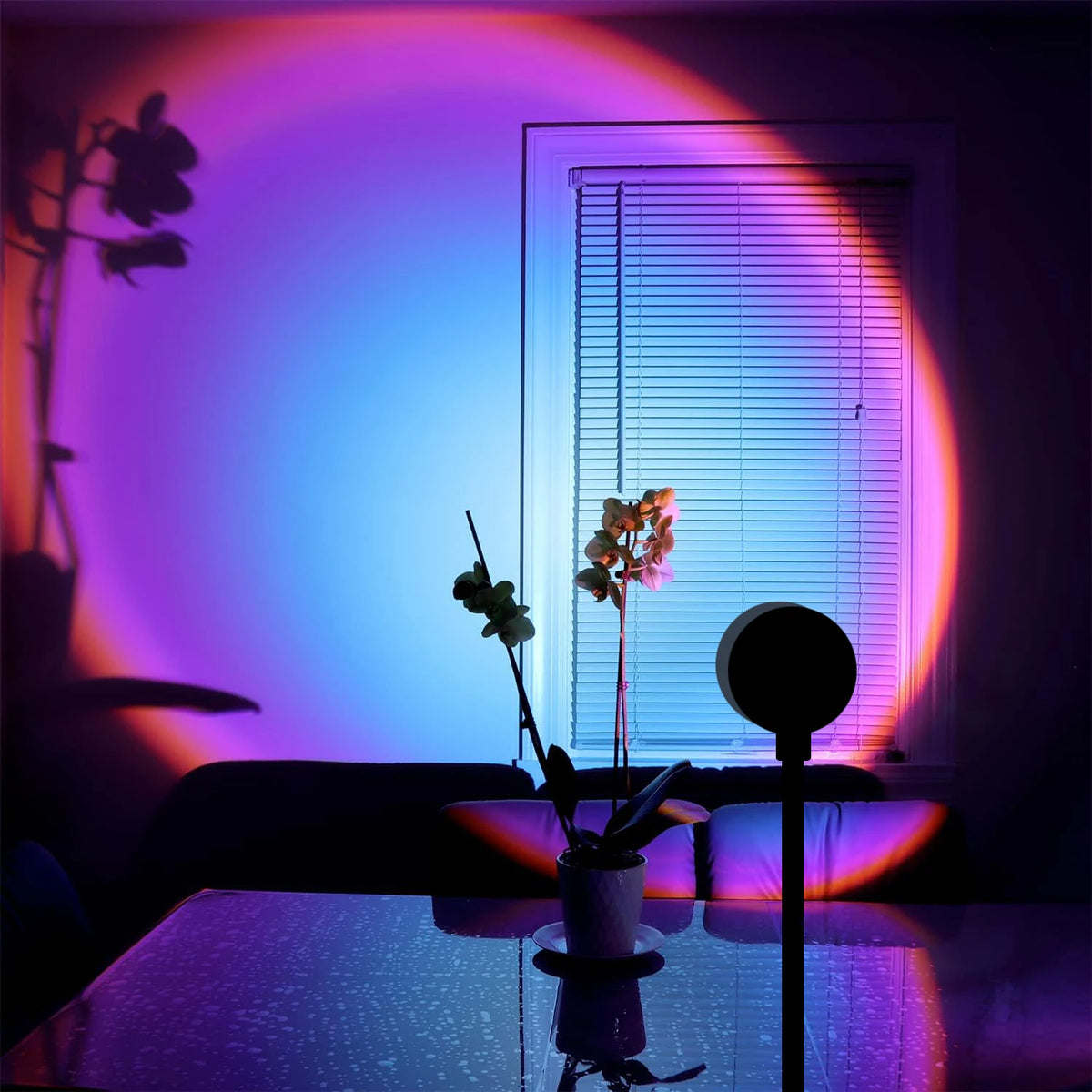 Sunset projection lamp casting a rainbow glow on a wall