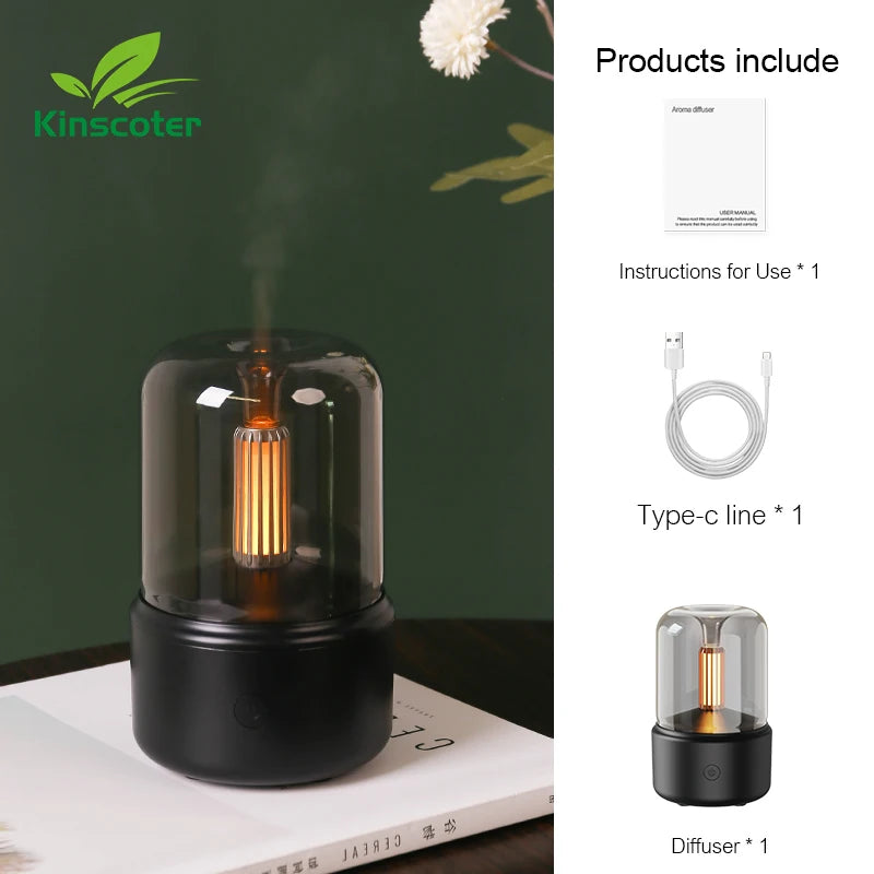 Black mini aroma diffuser with a glowing candle-style light, cable and instructions