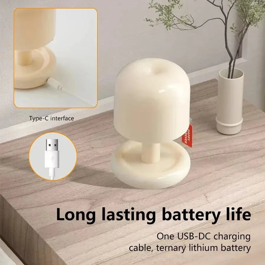Cream mushroom night lamp with its USB-C charging cable
