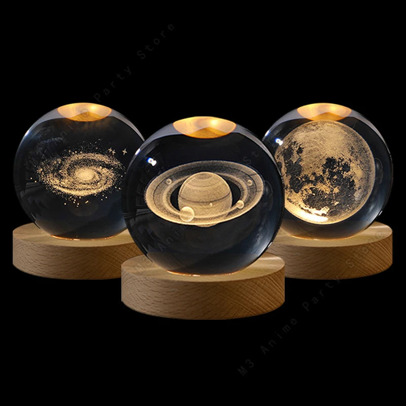 Three mini crystal ball night lights with a galaxy, Saturn and moon