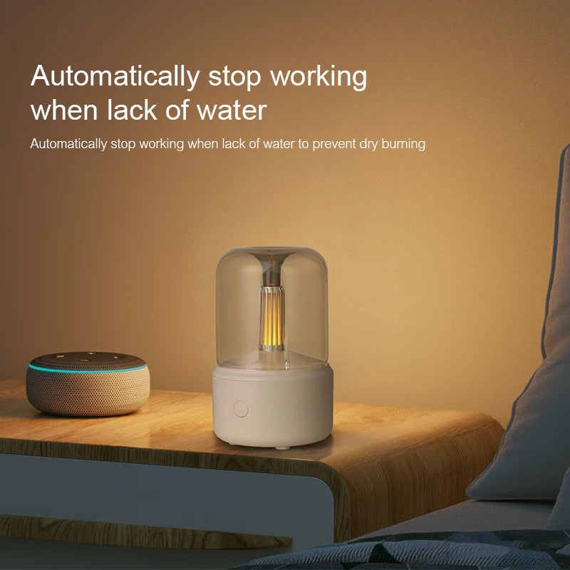 Beige mini aroma diffuser glowing on a bedside table