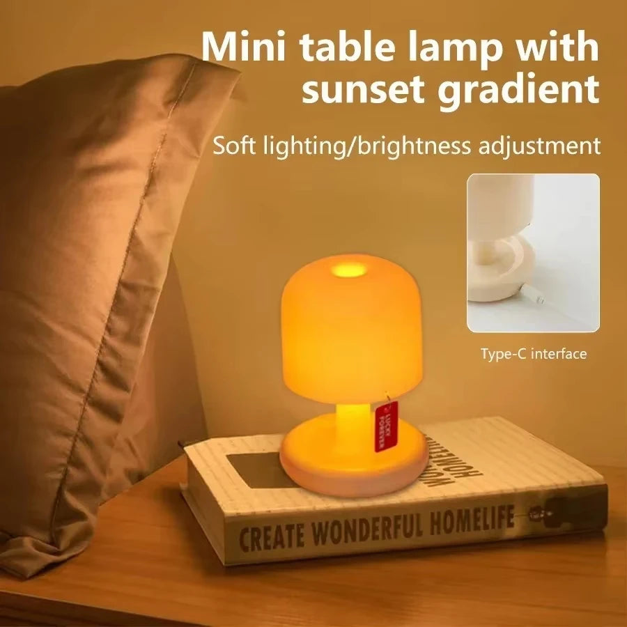 Mushroom night lamp with a sunset glow on a stack of books