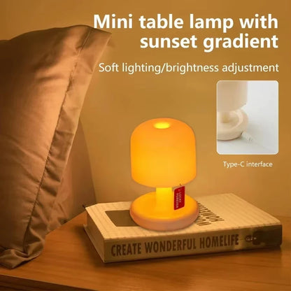 Mushroom night lamp with a sunset glow on a stack of books