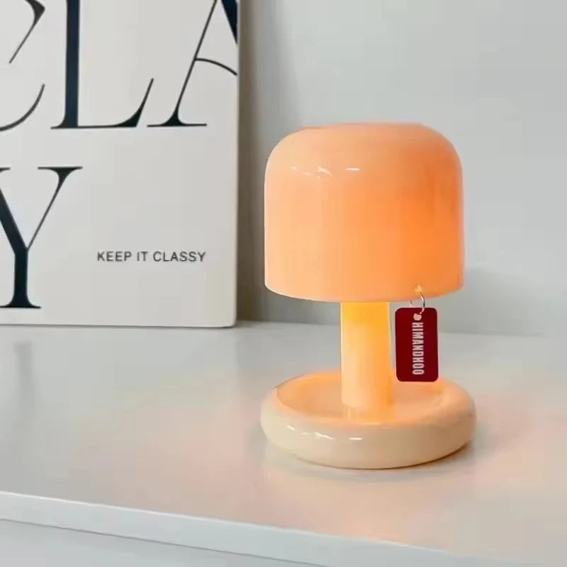Mushroom night lamp glowing on a shelf