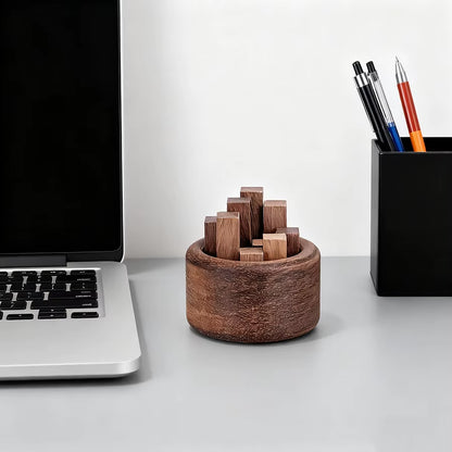 Wooden fragrance diffuser on a desk beside a laptop
