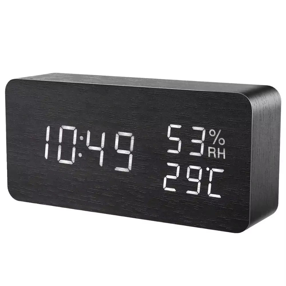 Black wooden LED alarm clock showing time, humidity and temperature