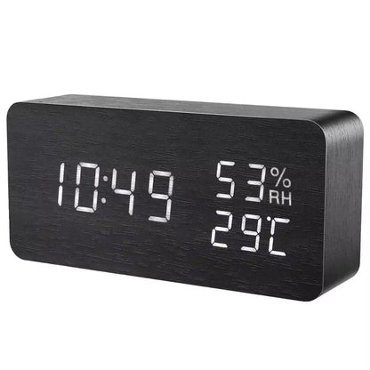 Black wooden LED alarm clock showing time, humidity and temperature